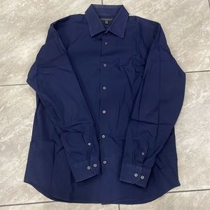1 long sleeve button down shirt in navy blue. Excellent condition.